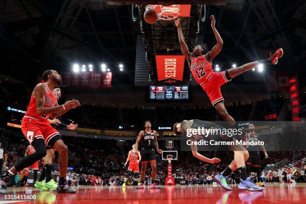 Ayo Dosunmu of the Chicago Bulls drives to the basket over Alperen Sengun of the Houston Rockets during the first half at Toyota Center on November...