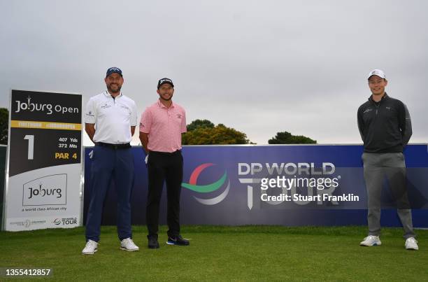 David Howell of England, Dean Burmester of South Africa and Marcus Helligkilde of Denmark pose for a photograph on the first tee as prepare to...