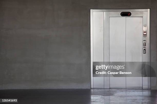 an elevator on the second floor - elevator door stock pictures, royalty-free photos & images