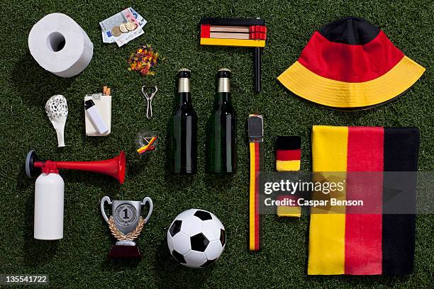 sporting equipment and accessories arranged on turf - german film ball stock-fotos und bilder