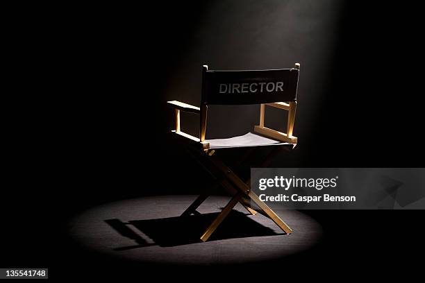 a spot lit directors chair - cadeira - fotografias e filmes do acervo