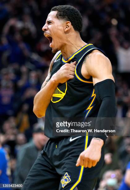 Juan Toscano-Anderson of the Golden State Warriors reacts after a dunk against the Philadelphia 76ers during the fourth quarter at Chase Center on...