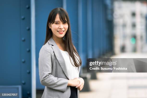 an office where seniors and young people work together. - japanese ethnicity stockfoto's en -beelden