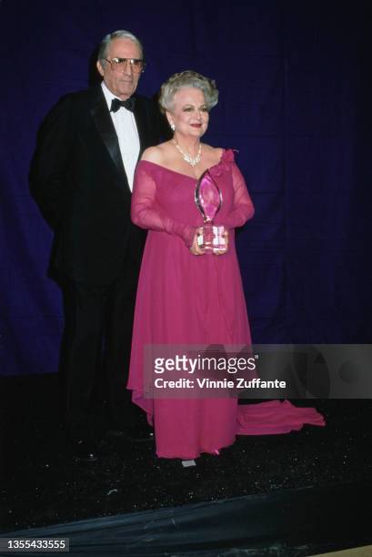 American actor Gregory Peck and British-American actress Olivia de Havilland ) attend 15th Annual People's Choice Awards, held at Disney Studios in...