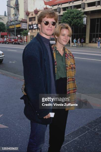 American actor Eric Stoltz and American actress Bridget Fonda attend the Hollywood premiere of 'Beauty and the Beast', held at the El Capitan Theatre...