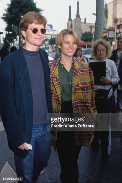 American actor Eric Stoltz and American actress Bridget Fonda attend the Hollywood premiere of 'Beauty and the Beast', held at the El Capitan Theatre...
