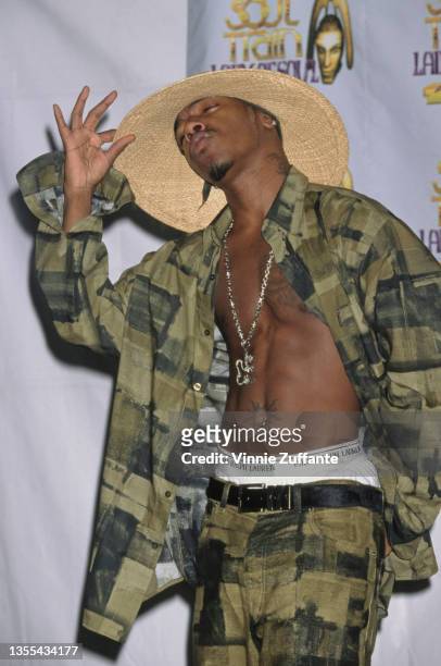 American singer Sisqo, wearing wide brim straw hat with a green-and-black shirt and matching trousers, attends the 5th Annual Soul Train Lady of Soul...