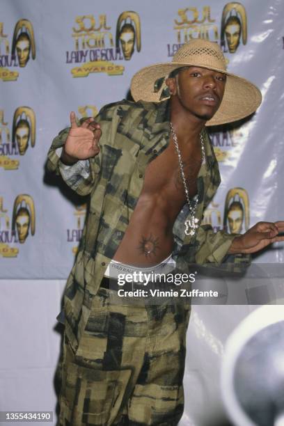 American singer Sisqo, wearing wide brim straw hat with a green-and-black shirt and matching trousers, attends the 5th Annual Soul Train Lady of Soul...