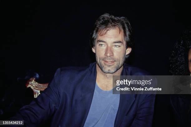 British actor Timothy Dalton, wearing a dark blue blazer over a blue t-shirt, attends the closing night performance of 'Love Letters' at the Canon...