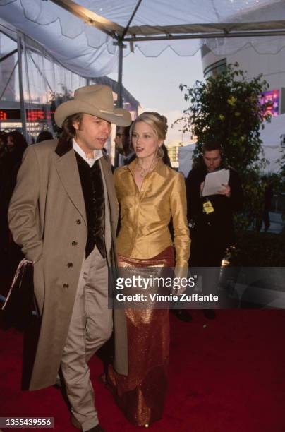 American singer-songwriter and guitarist Dwight Yoakam and American actress Bridget Fonda attend the 42nd Grammy Awards, held at the Staples Center...