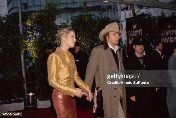American actress Bridget Fonda and American singer-songwriter and guitarist Dwight Yoakam attend the 42nd Grammy Awards, held at the Staples Center...
