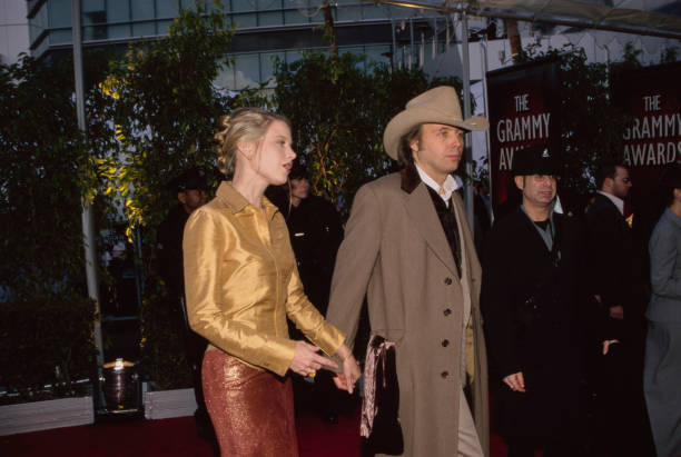 American actress Bridget Fonda and American singer-songwriter and guitarist Dwight Yoakam attend the 42nd Grammy Awards, held at the Staples Center...