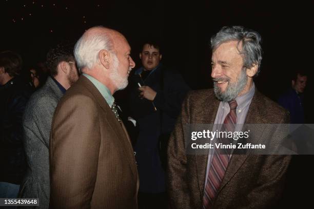 American theatrical director and producer Hal Prince , wearing a brown blazer and a green shirt with a spotted tie, and American composer and...