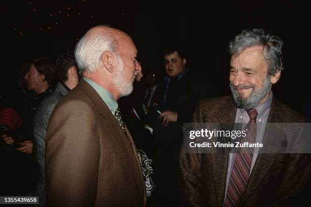 American theatrical director and producer Hal Prince , wearing a brown blazer and a green shirt with a spotted tie, and American composer and...