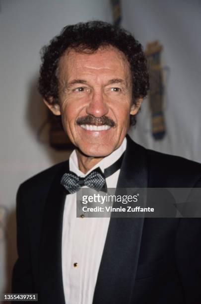 American stock car racing driver Richard Petty, wearing a tuxedo and bow tie, attends Sports Illustrated's 20th Century Sports Awards, held at...