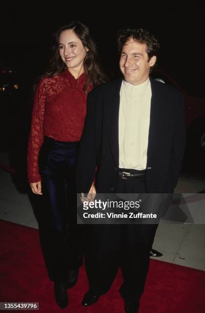 American actress Madeleine Stowe and her husband, actor Brian Benben attend the Beverly Hills premiere of 'Short Cuts' held at Samuel Goldwyn Theatre...