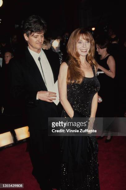 American actress Cassandra Peterson and a man attend the 21st Annual Saturn Awards, held at the JW Marriott Hotel in Century City, California, 26th...