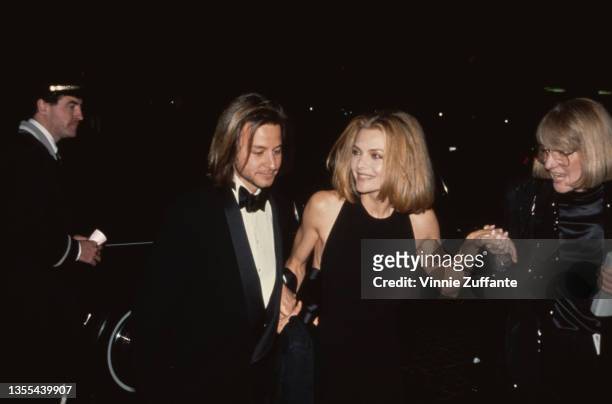 American actor Fisher Stevens and American actress Michelle Pfeiffer attend the 49th Golden Globe Awards, held at the Beverly Hilton Hotel in Beverly...