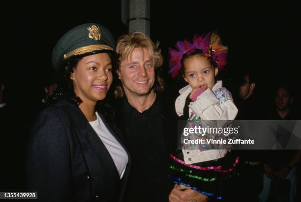 American radio personality Shadoe Stevens with his wife Beverly Cunningham and their daughter, Amber, attend the grand opening of Alzado's Restaurant...