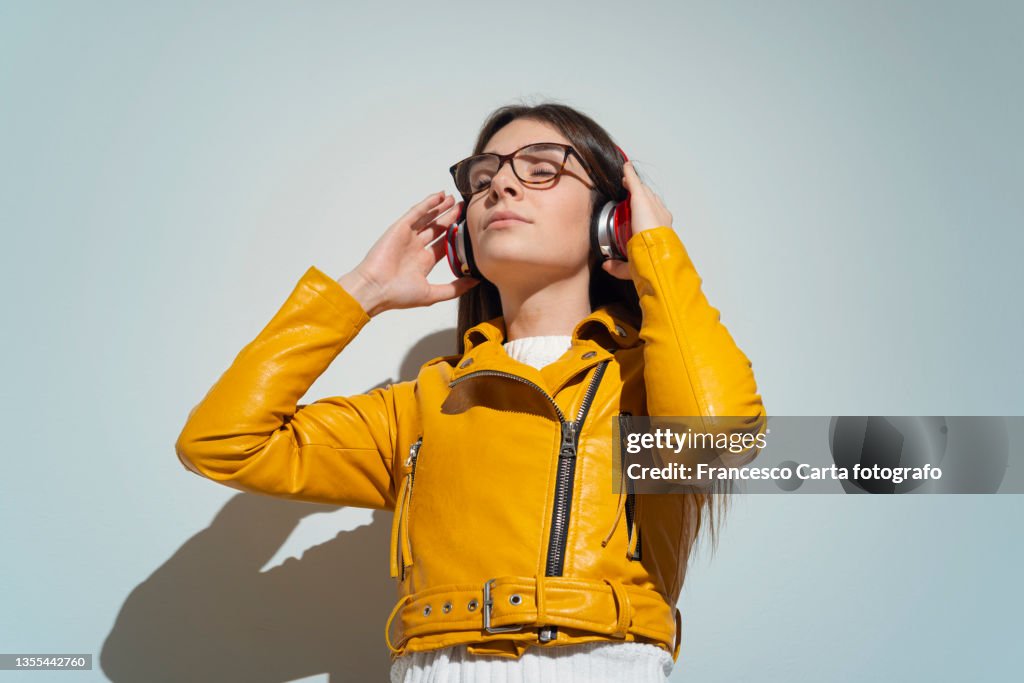 Young woman listen the music song in wireless headphone