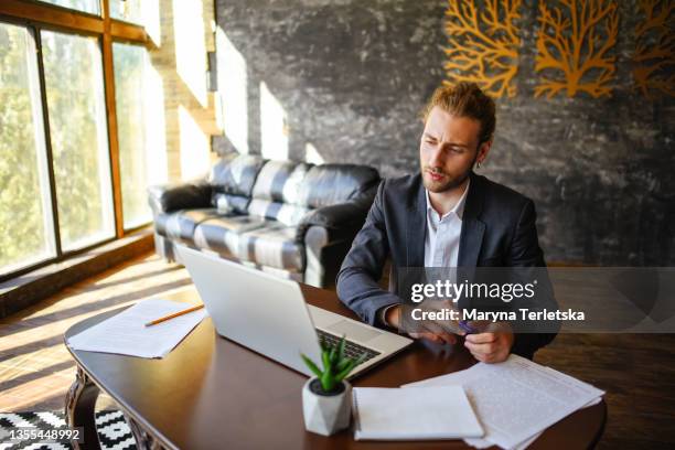 businessman working remotely from home office. - compere stock pictures, royalty-free photos & images