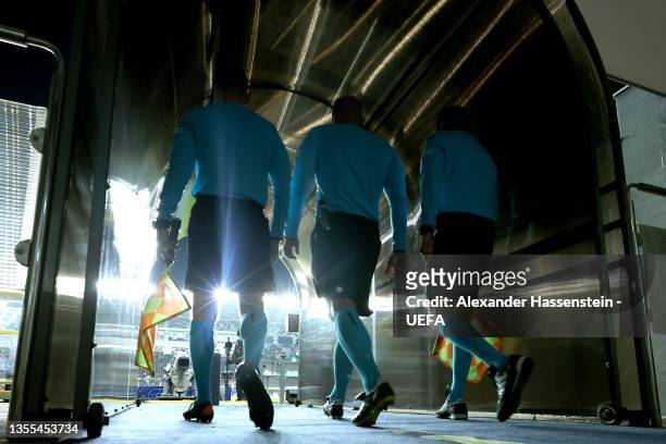 The referees Enter enter the field through the player tunnel for the UEFA Champions League group D match between FC Sheriff and Real Madrid at...