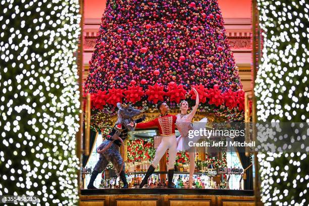 Scottish Ballet dancers Roseanna Leney as The Sugarplum Fairy, Jerome Barnes as The Nutcracker Prince and Javier Andreu as The Rat King posing in The...