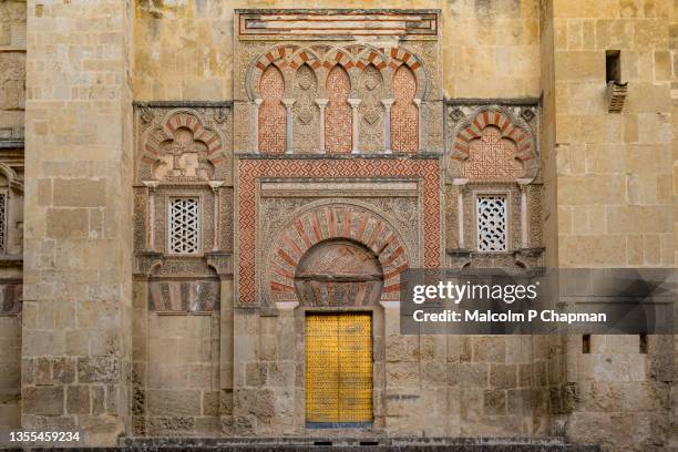 mezquita cathedral, cordoba - exterior wall from street - córdoba stock pictures, royalty-free photos & images