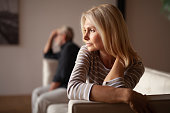 The older couple has a conflict. Upset mature woman, quarrel with her husband. Relationship crisis