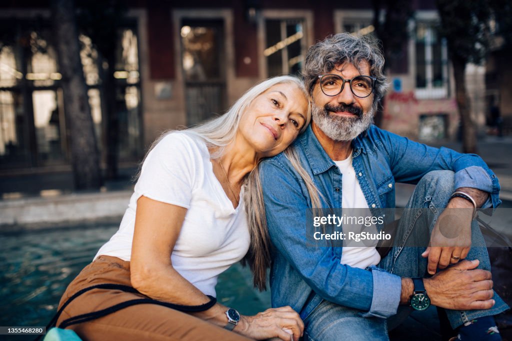 Portrait of a happy mature couple enjoying their romantic vacation in Barcelona
