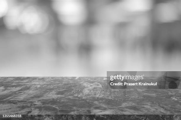 concrete countertop with window background - enfoque de objeto sobre a mesa - fotografias e filmes do acervo