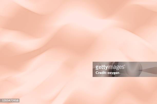 pink silk satin abstract ribbon background. wedding anniversary valentine abstract background. pastel champane colored soft flowing wave curve background - de color melocotón fotografías e imágenes de stock