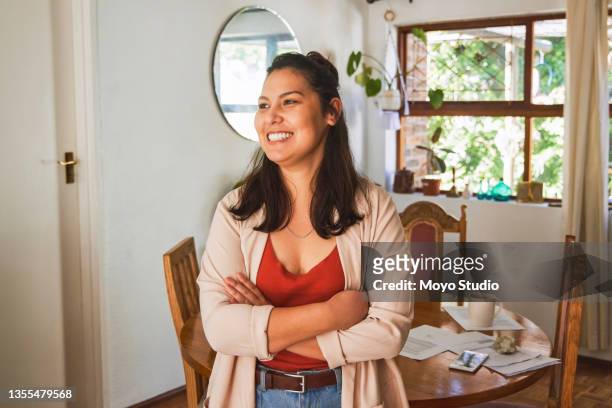 shot of an attractive young woman taking a break from working at home - debt free stock pictures, royalty-free photos & images