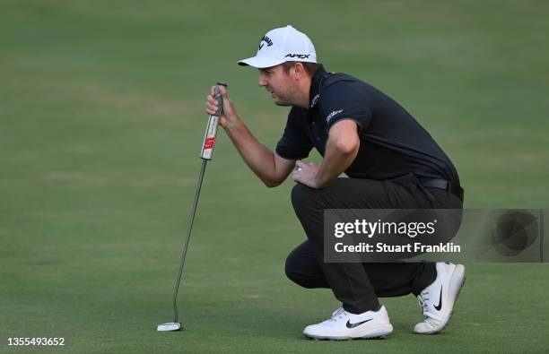 Ashley Chesters of England lines up a putt on the eighth hole during Day One of the JOBURG Open at Randpark Golf Club on November 25, 2021 in...