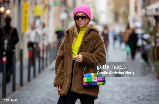 Sonia Lyson is seen wearing Louis Vuitton heels, Zara pants, yellow turtleneck Zara, short teddy coat Max Mara, Louis Vuitton multi colored bag,...