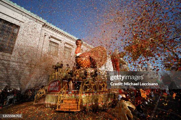Confetti explodes around the Tom Turkey float as the 95th Macy's Thanksgiving Day Parade kicks off on November 25, 2021 in New York City.