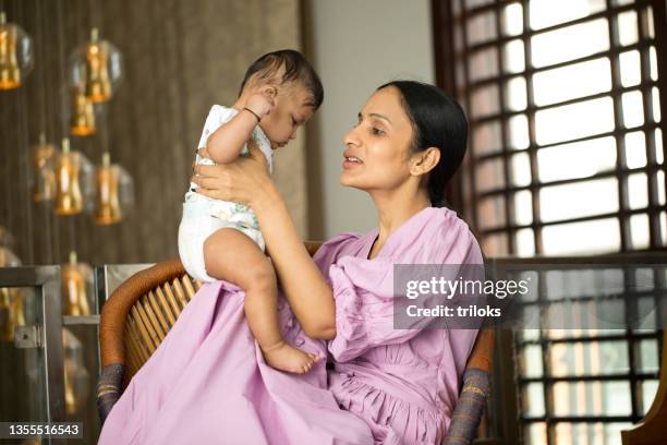 loving mother and baby son - indian mother stockfoto's en -beelden