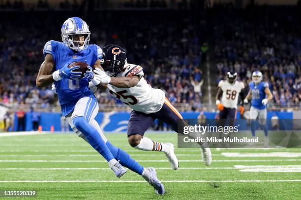 Josh Reynolds of the Detroit Lions catches a touchdown pass over Artie Burns of the Chicago Bears during the first quarter at Ford Field on November...