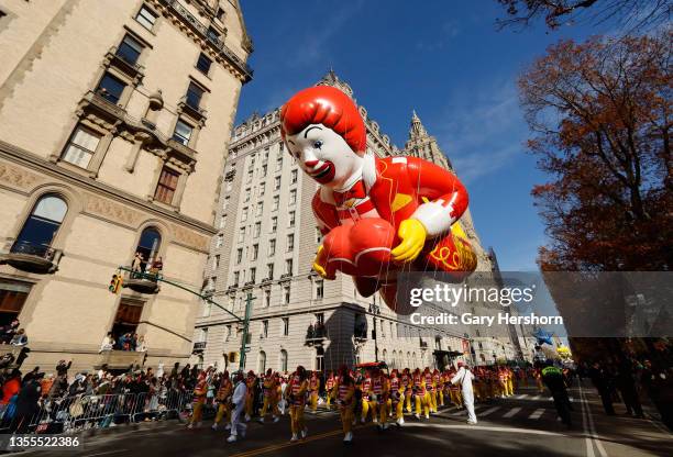 The Ronald McDonald balloon floats along Central Park West in the Macy's Thanksgiving Day Parade on November 25, 2021 in New York City.