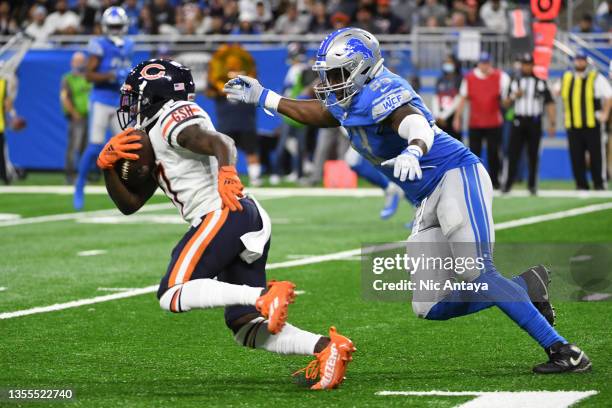 Charles Harris of the Detroit Lions goes to tackle Jakeem Grant of the Chicago Bears during the first quarter at Ford Field on November 25, 2021 in...