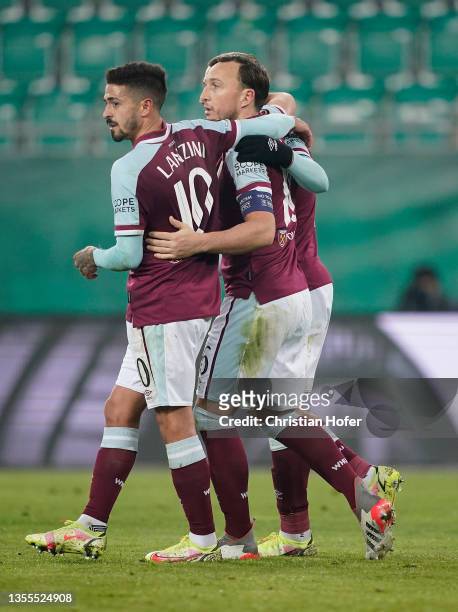 Mark Noble of West Ham United celebrates with teammate Manuel Lanzini after scoring their side’s second goal from the penalty spot during the UEFA...