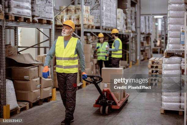 keeping up with the movement of stocks - pallet jack stock pictures, royalty-free photos & images