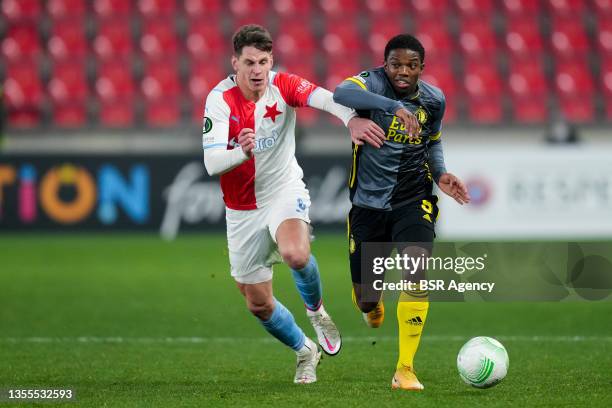 Lukas Masopust of SK Slavia Prague competes for the ball with Tyrell Malacia of Feyenoord Rotterdam during the UEFA Conference League Group Stage...