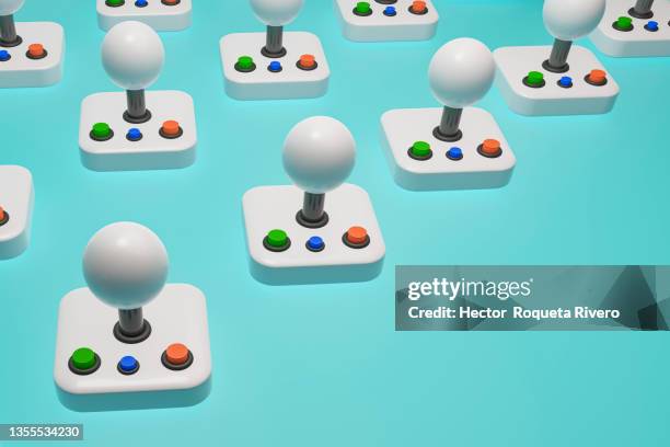 3d render of many retro white jostick with three buttons, red, green and blue in blue background - palanca fotografías e imágenes de stock