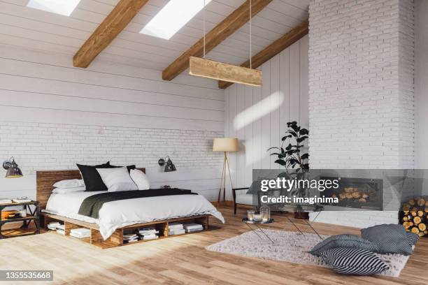 scandinavian bedroom in a luxurious cottage house - slaapkamer stockfoto's en -beelden