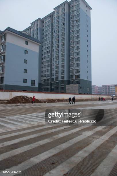 people walking at ew square and new residential building and district at longxian - ew stock pictures, royalty-free photos & images