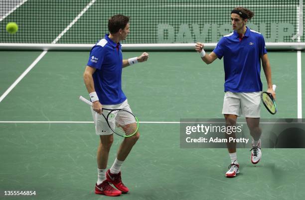 Pierre-Hugues Herbert and Nicolas Mahut of France celebrate winning a point over Jiri Lehecka and Tomas Machac of the Czech Republic during the group...