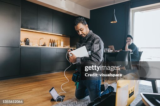Technician installing wifi router at home Technician installing wifi router at home