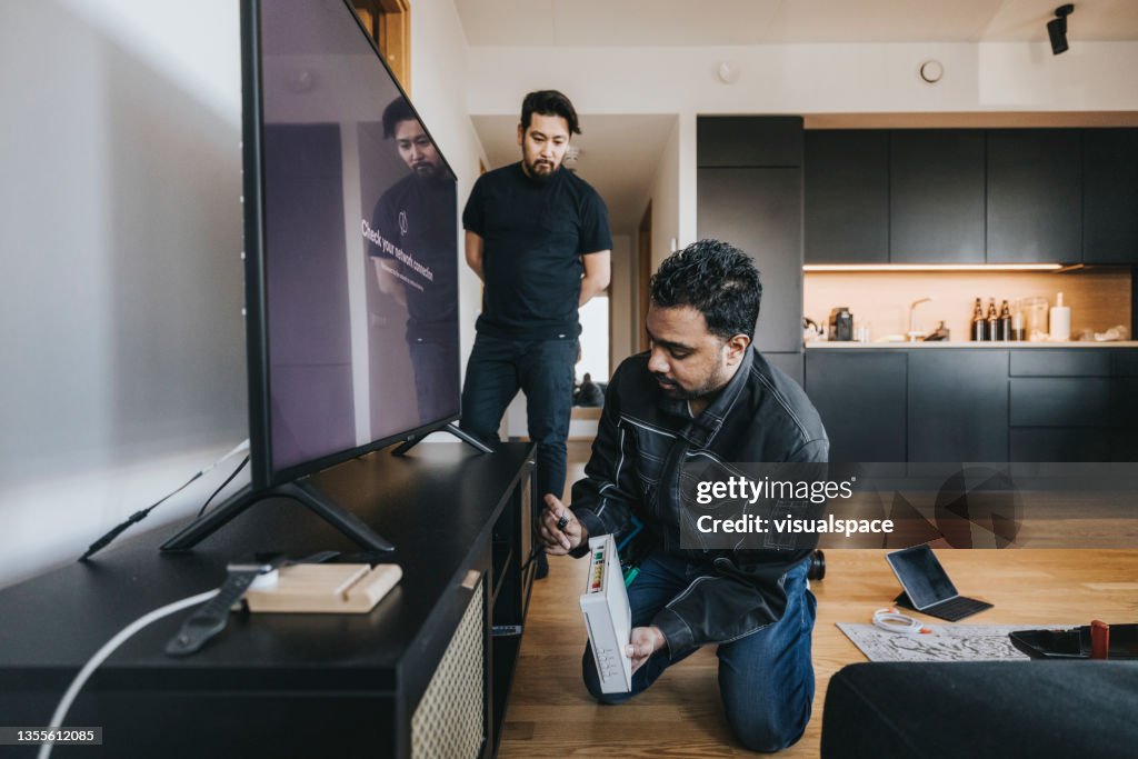IT technician installing wifi router