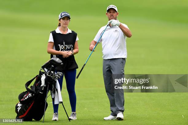 Jaco Van Zyl of South Africa and his caddie on the 14th hole during the second round of the JOBURG Open at Randpark Golf Club on November 26, 2021 in...